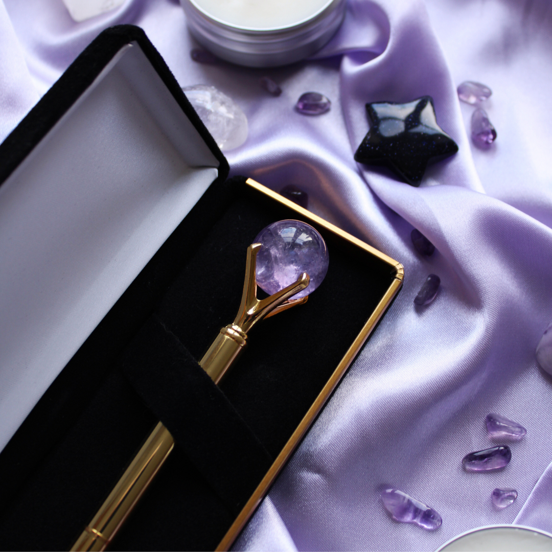 Gold crystal pen surrounded by crystals for anxiety relief
