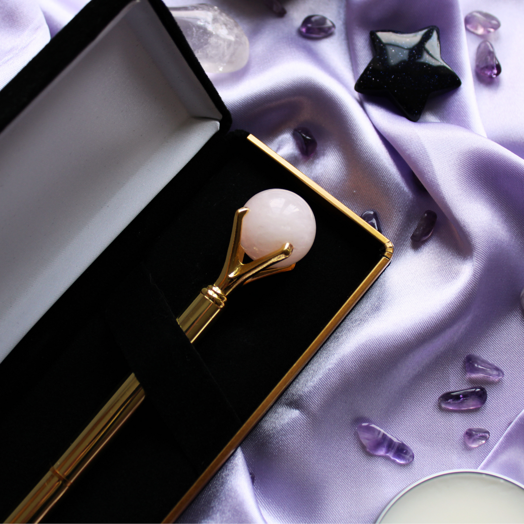 Gold crystal pen surrounded by self love crystals