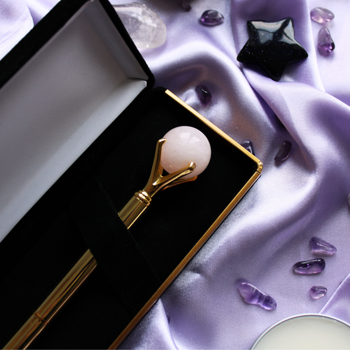 Gold crystal pen surrounded by self love crystals
