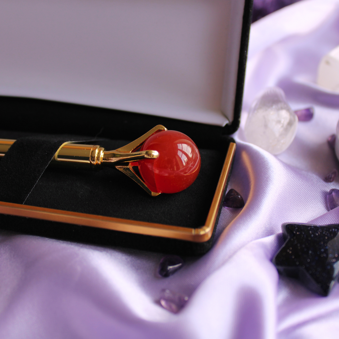 Gold crystal pen surrounded by crystals for motivation