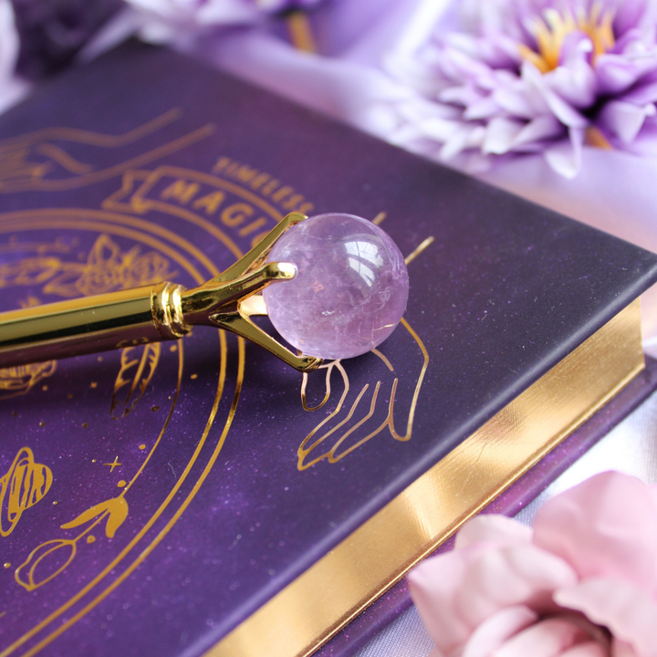 A collection of crystal ball pens with different crystal properties