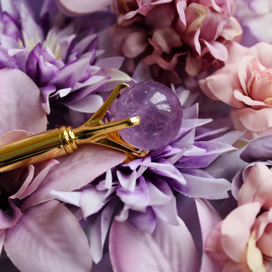 Amethyst pen lying on a bed of purple flowers