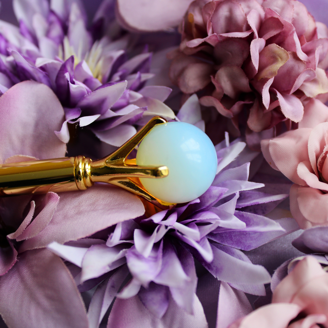 White Opal pen lying on a bed of purple flowers